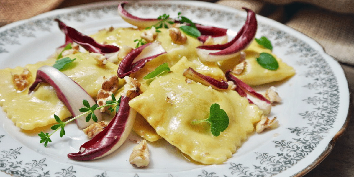 Ravioli pasta filled with ricotta cheese and spinach* with brown butter and nuts