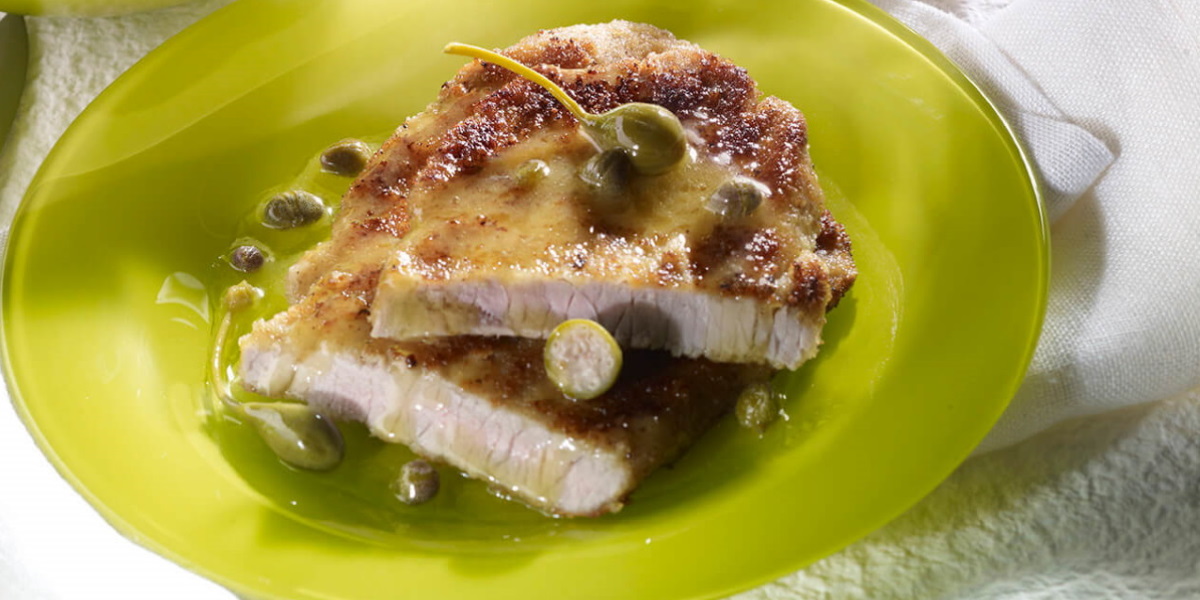 Veal escalope with citrus demi gIace and vegetables